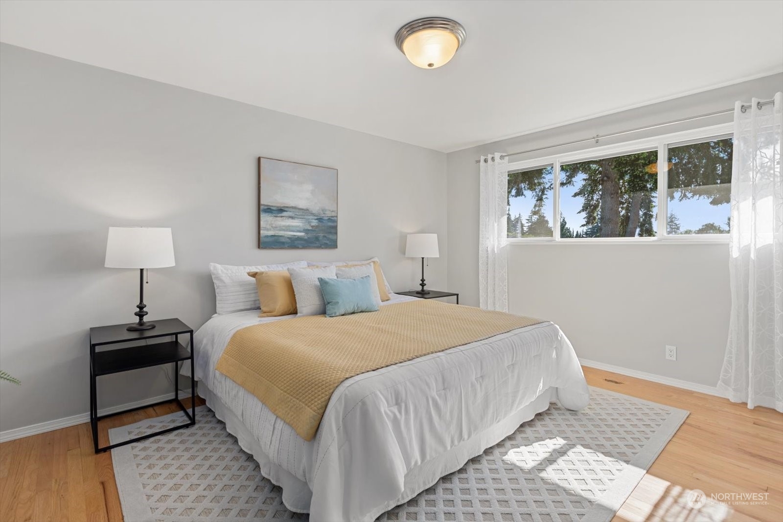8630 217th Street Southwest Edmonds, WA 98026 - Photo 21 of 34 a bedroom with a bed lamp on table and a window