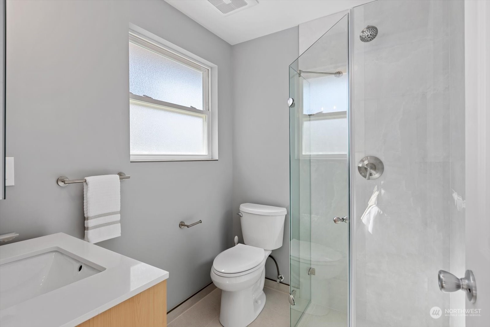 8630 217th Street Southwest Edmonds, WA 98026 - Photo 23 of 34 a white toilet sitting next to a bathroom sink