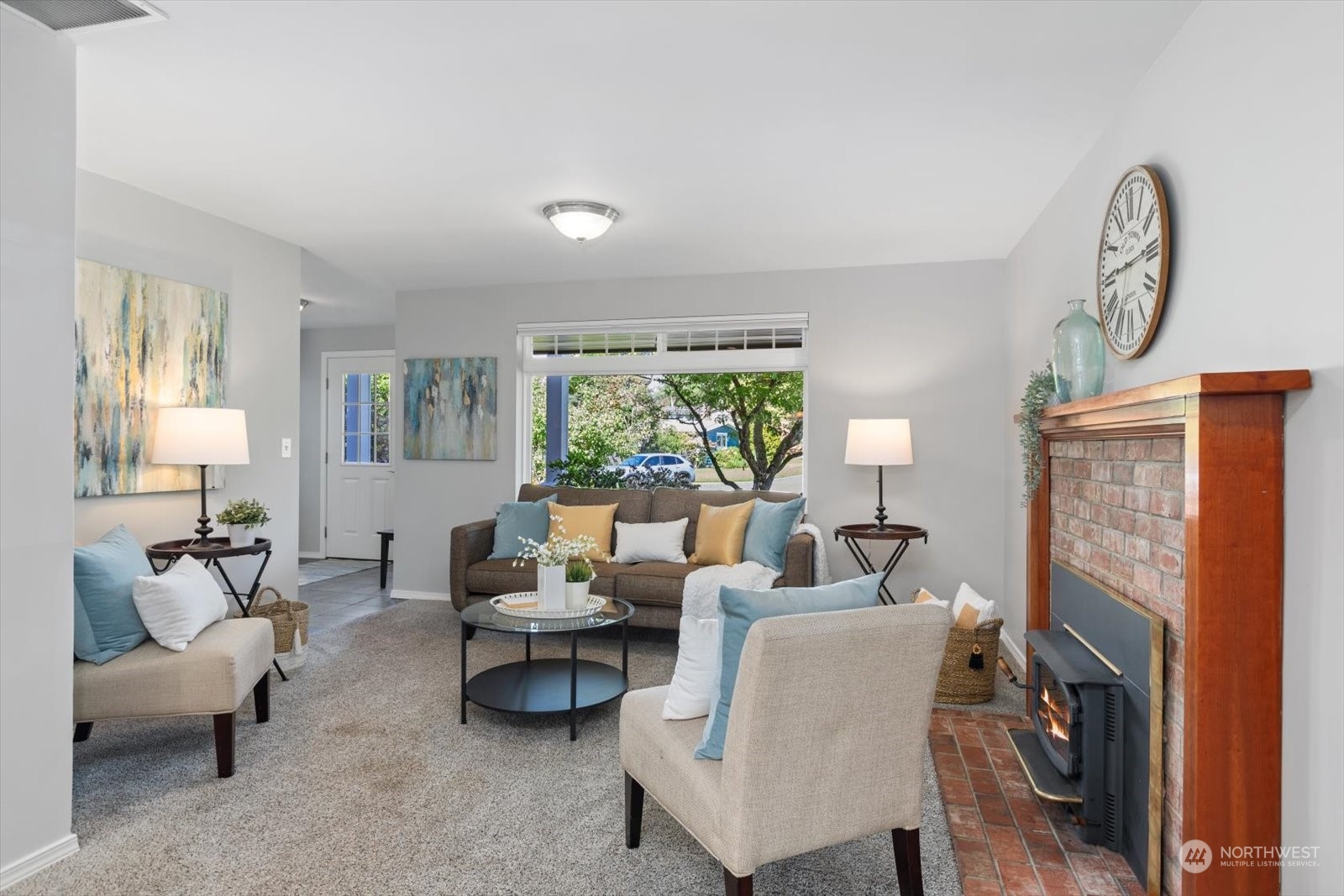 8630 217th Street Southwest Edmonds, WA 98026 - Photo 7 of 34 a living room with furniture and a fireplace