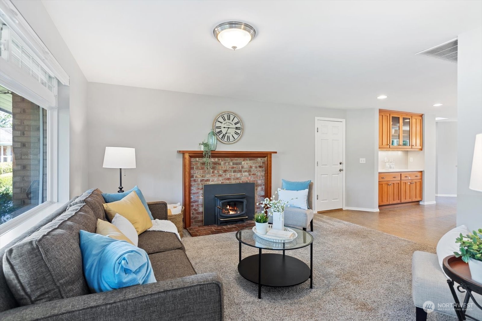 8630 217th Street Southwest Edmonds, WA 98026 - Photo 8 of 34 a living room with furniture and a fireplace