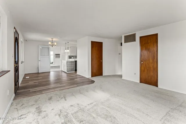 a view of a room with a furniture and refrigerator