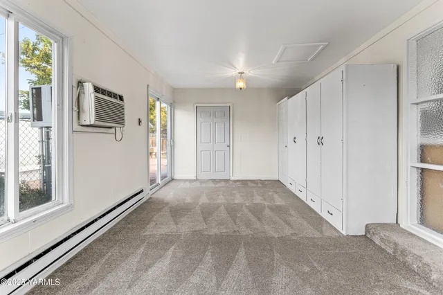 a view of an empty room with a window