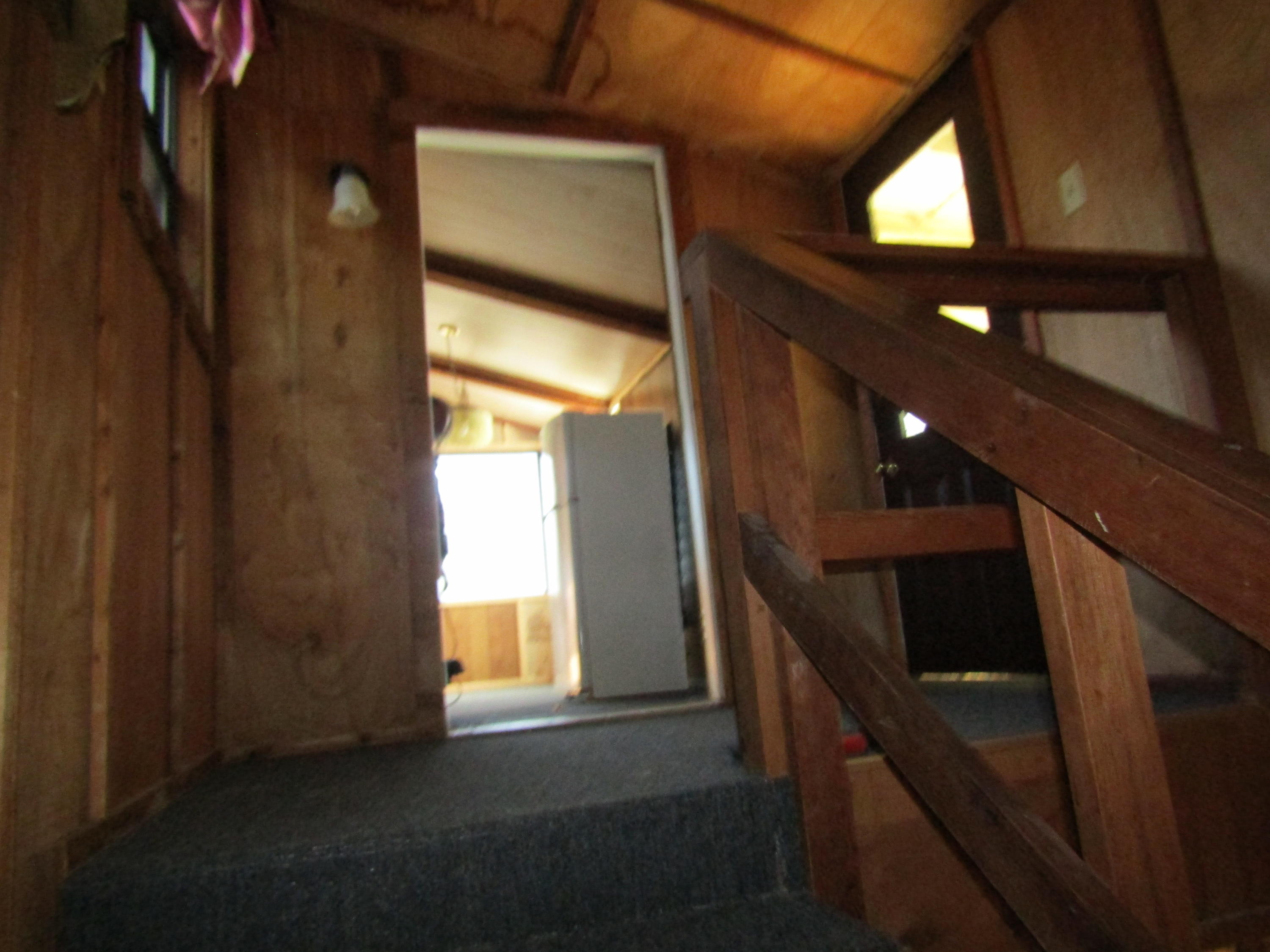 35 Glasgow Road DeFuniak Springs, FL 32433 - Photo 21 of 39 Stair Case into the kitchen
