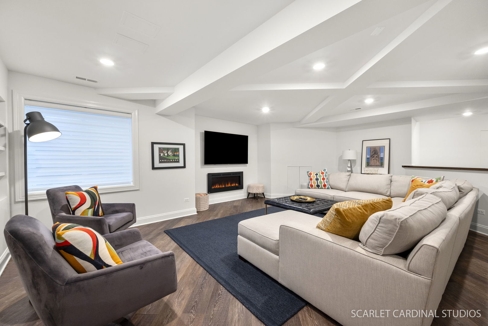 716 Wellner Road Naperville, IL 60540 - Photo 32 of 52 a living room with furniture and a flat screen tv
