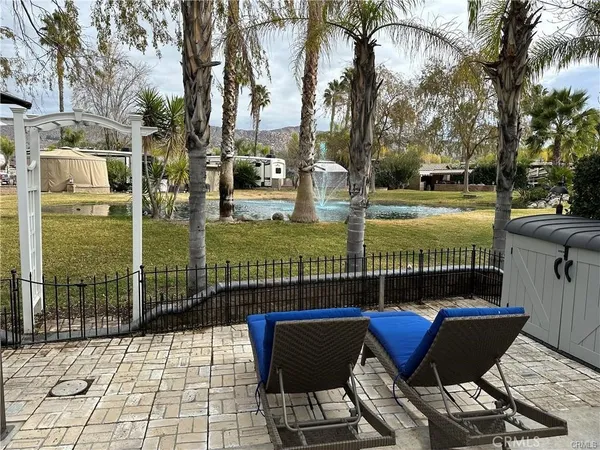 a view of a chair and tables in the patio