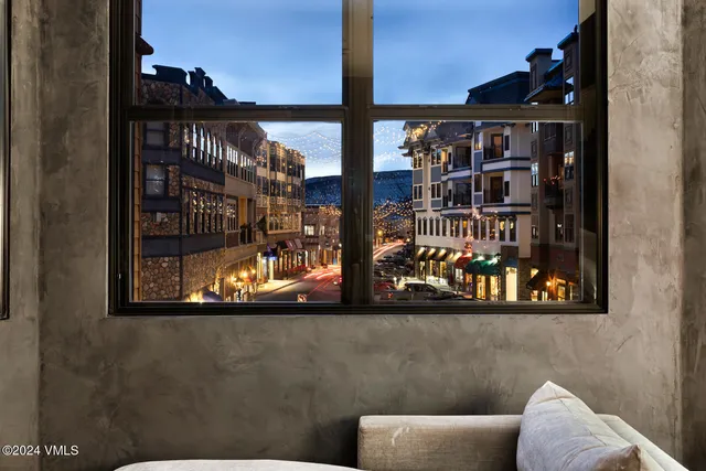 a view of walk in closet with clothes