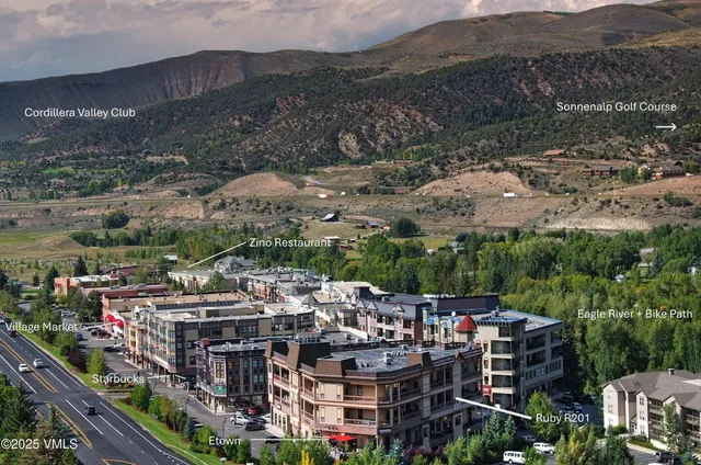 an aerial view of a building with a street