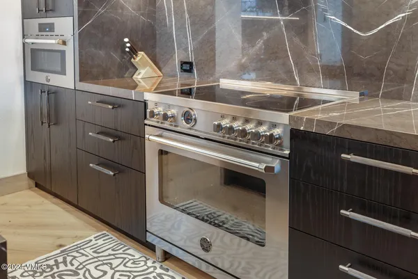 a kitchen with a stove and a refrigerator