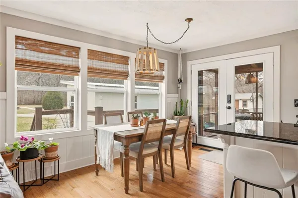 a view of a dining room with furniture window and wooden floor