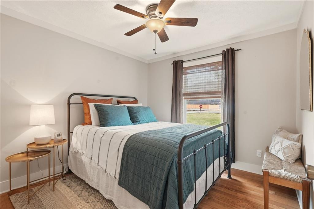 21 McIntosh Lane Rabun Gap, GA 30568 - Photo 17 of 50 a bedroom with a bed and wooden floor