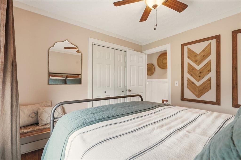 21 McIntosh Lane Rabun Gap, GA 30568 - Photo 18 of 50 a bedroom with a large bed and a painting on the wall