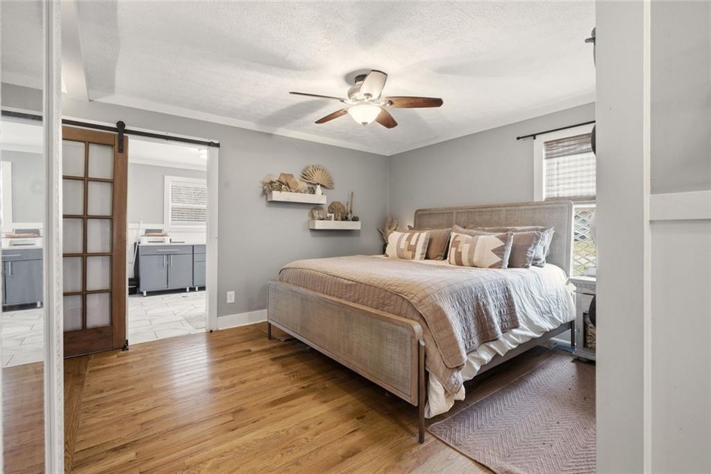21 McIntosh Lane Rabun Gap, GA 30568 - Photo 21 of 50 a spacious bedroom with a bed and a book shelf
