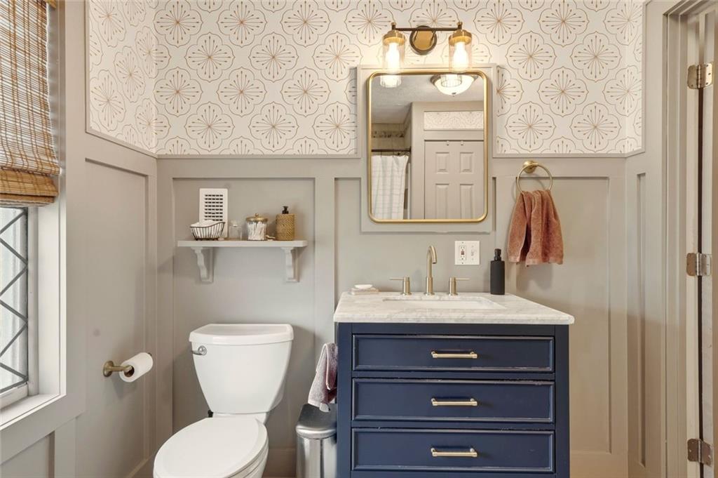 21 McIntosh Lane Rabun Gap, GA 30568 - Photo 25 of 50 a bathroom with a toilet sink and mirror