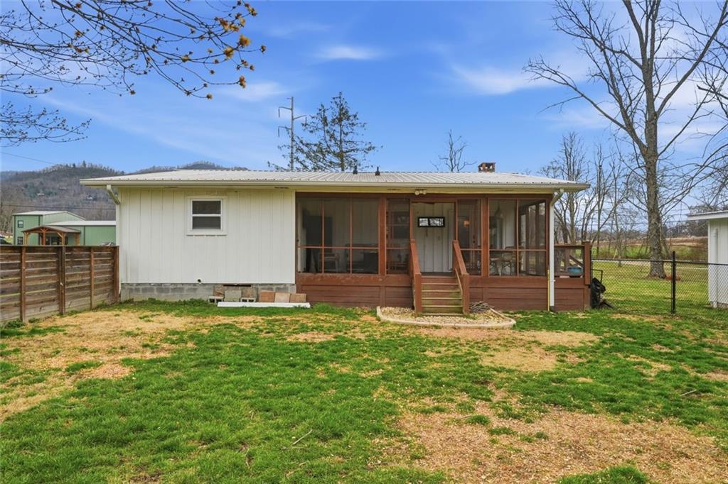 21 McIntosh Lane Rabun Gap, GA 30568 - Photo 33 of 50 a view of a house with backyard and a tree