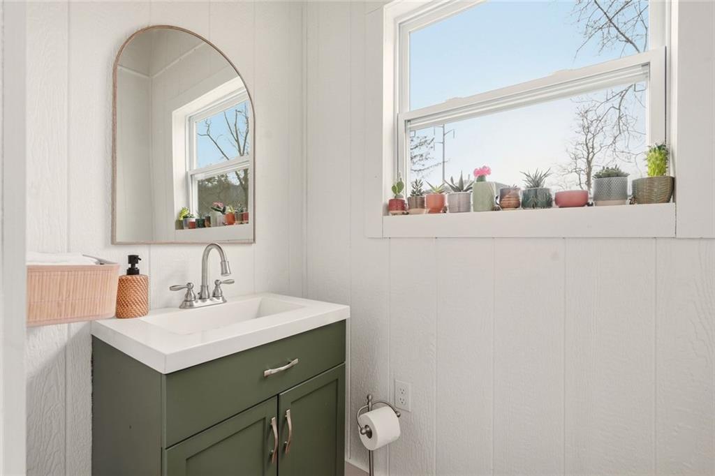 21 McIntosh Lane Rabun Gap, GA 30568 - Photo 43 of 53 a bathroom with a sink mirror and a window