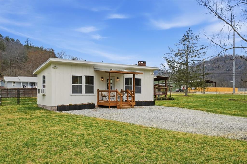 21 McIntosh Lane Rabun Gap, GA 30568 - Photo 44 of 50 a view of a house with backyard sitting area and garden