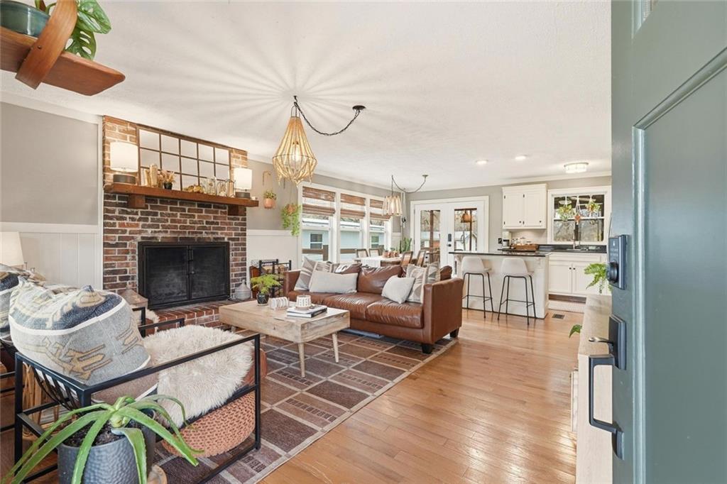 21 McIntosh Lane Rabun Gap, GA 30568 - Photo 5 of 50 a living room with furniture a fireplace and a table