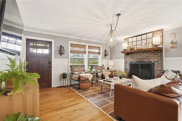 a living room with furniture windows and a fireplace