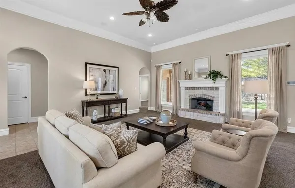 a living room with furniture and a fireplace