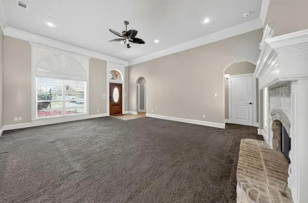 a view of livingroom and hallway with furniture