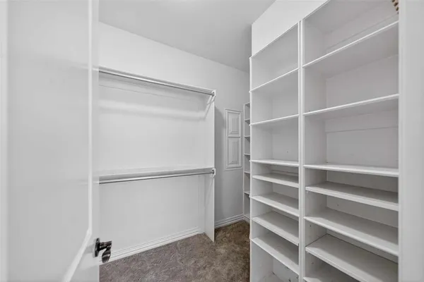 a view of an empty walk in closet