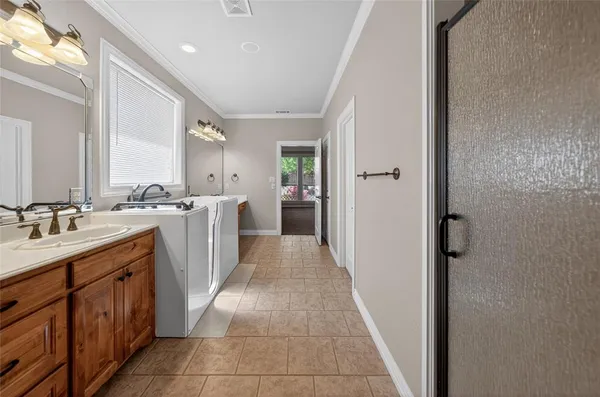 a kitchen with a sink and a refrigerator