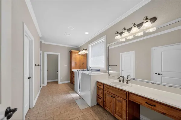 a spacious bathroom with a double vanity sink double and mirror