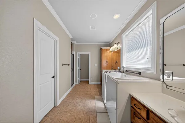 a kitchen with a sink and a refrigerator