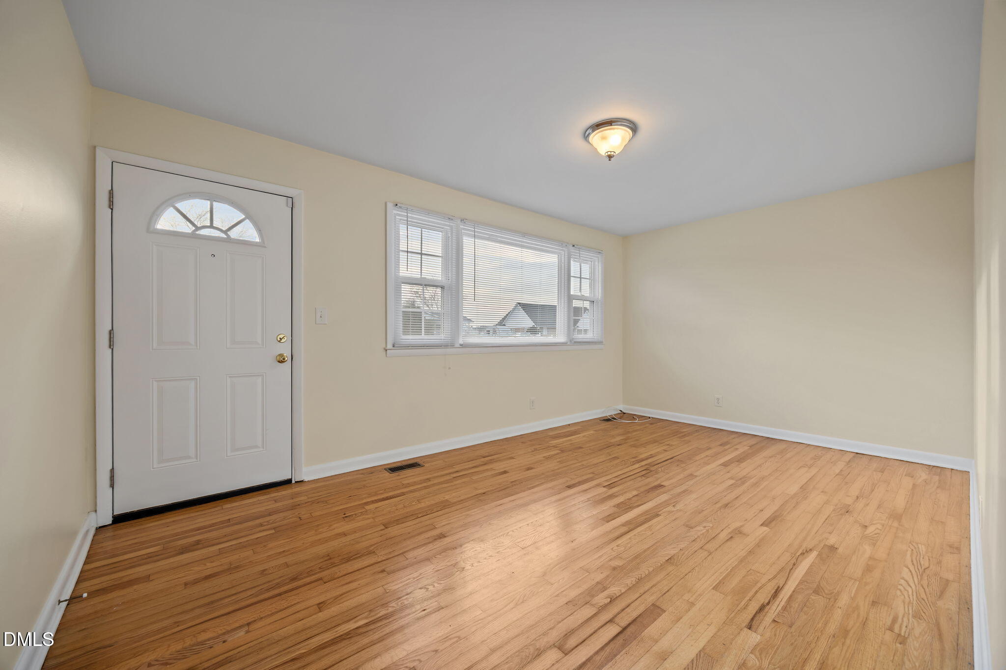 131 Fairview Village Road Dunn, NC 28334 - Photo 14 of 43 a view of empty room with wooden floor and fan