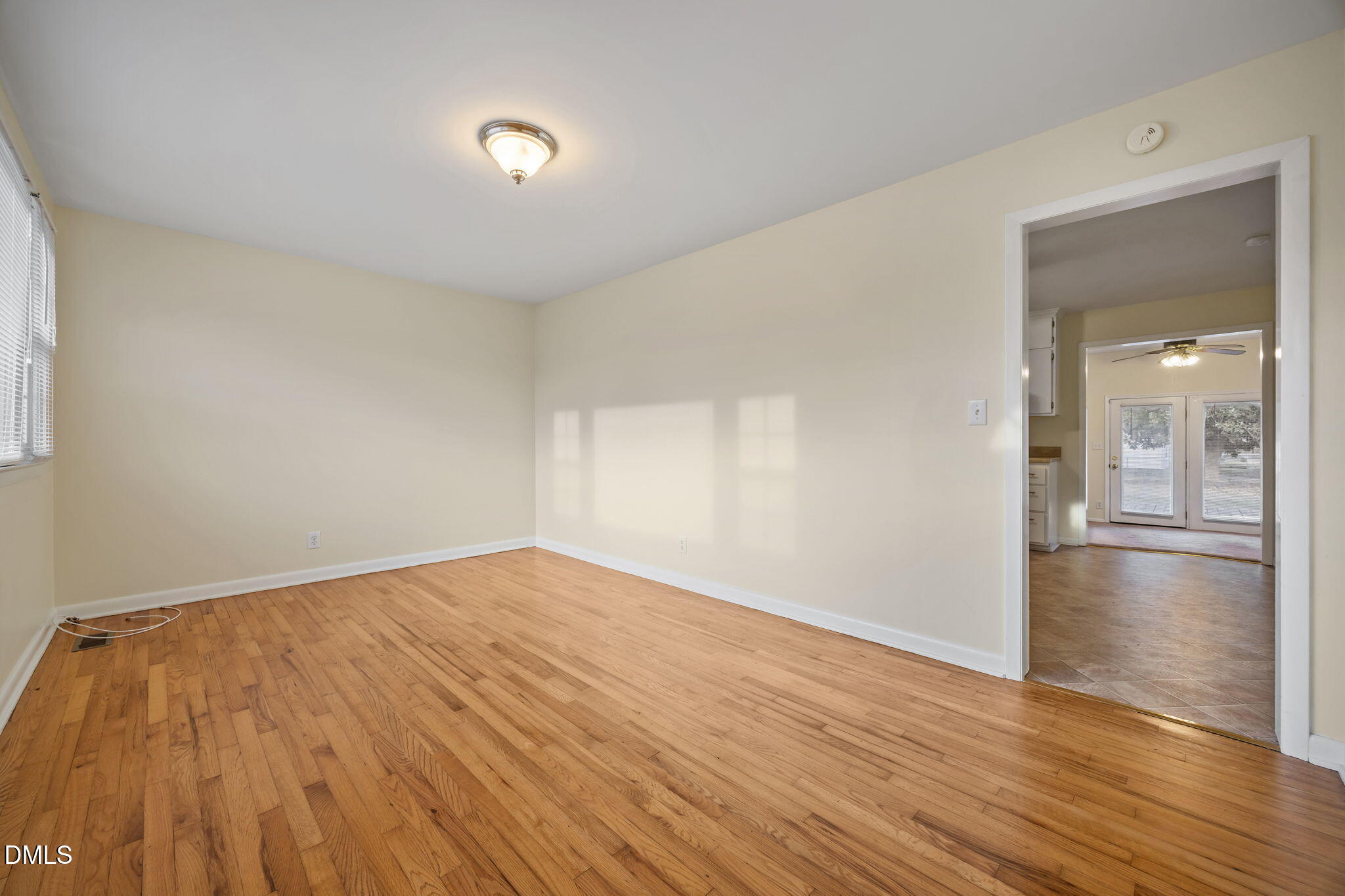 131 Fairview Village Road Dunn, NC 28334 - Photo 15 of 43 a view of empty room with wooden floor and fan
