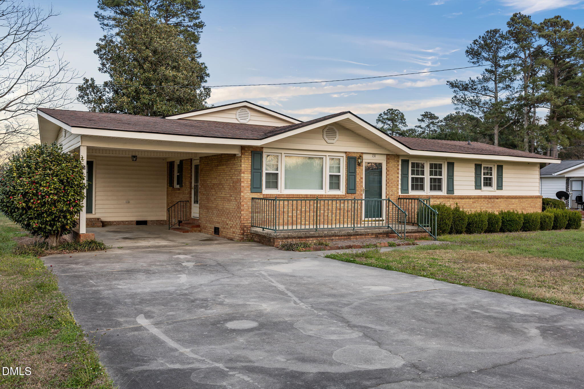 131 Fairview Village Road Dunn, NC 28334 - Photo 2 of 43 a view of a house with a yard and large tree
