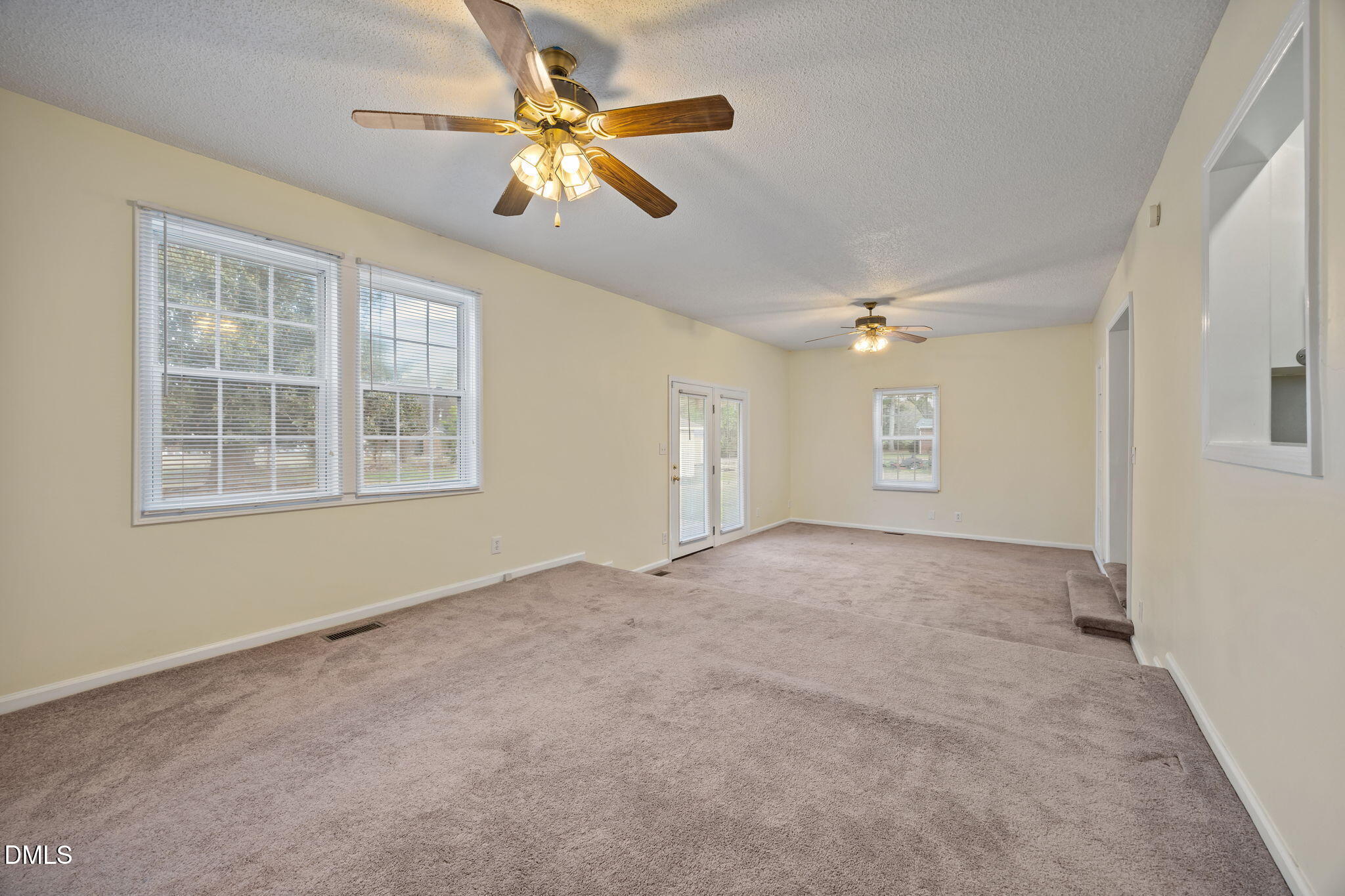 131 Fairview Village Road Dunn, NC 28334 - Photo 23 of 43 an empty room with windows and fan