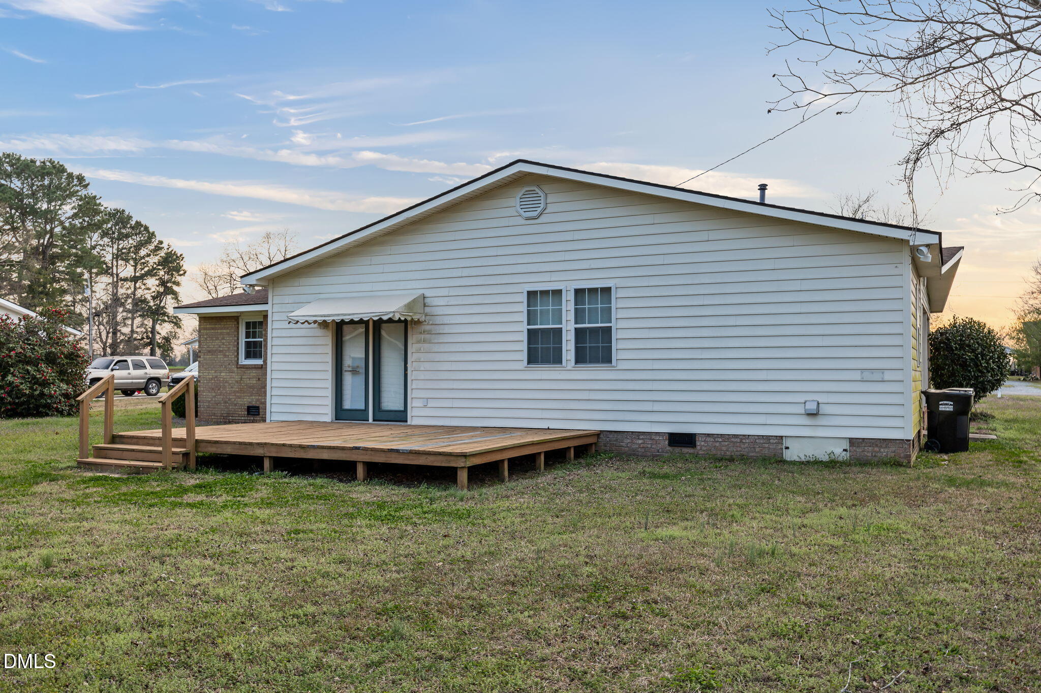 131 Fairview Village Road Dunn, NC 28334 - Photo 32 of 43 a view of a house with a yard and wooden fence