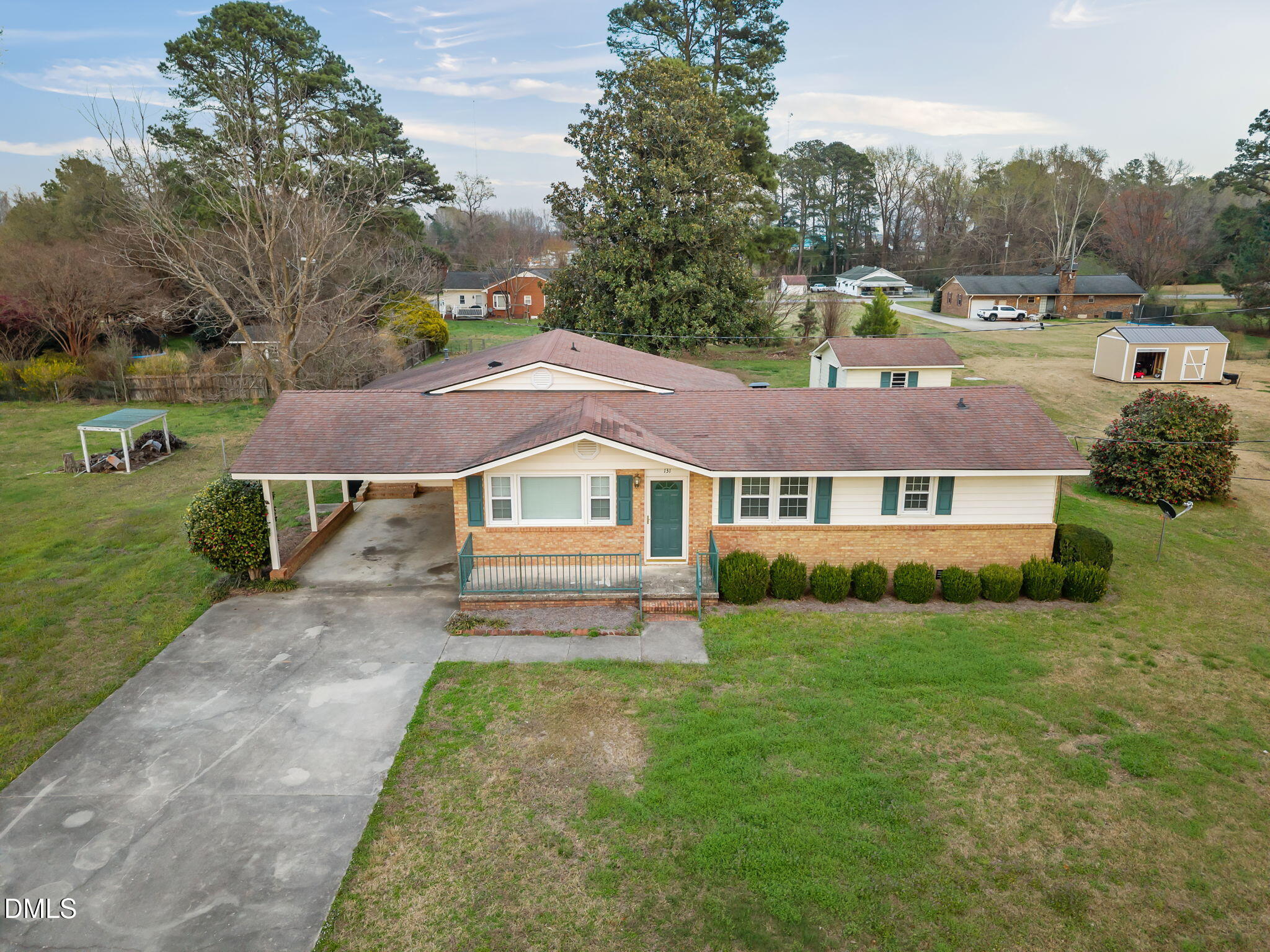 131 Fairview Village Road Dunn, NC 28334 - Photo 38 of 43 a view of a big house with a big yard and large trees