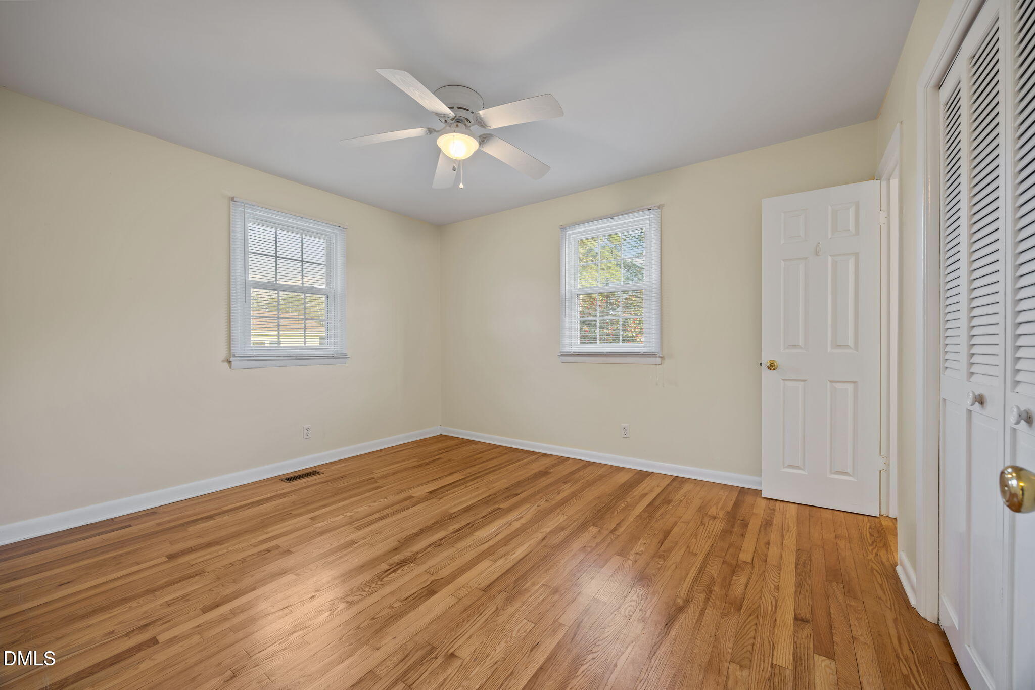 131 Fairview Village Road Dunn, NC 28334 - Photo 4 of 43 a view of an empty room with wooden floor and a window