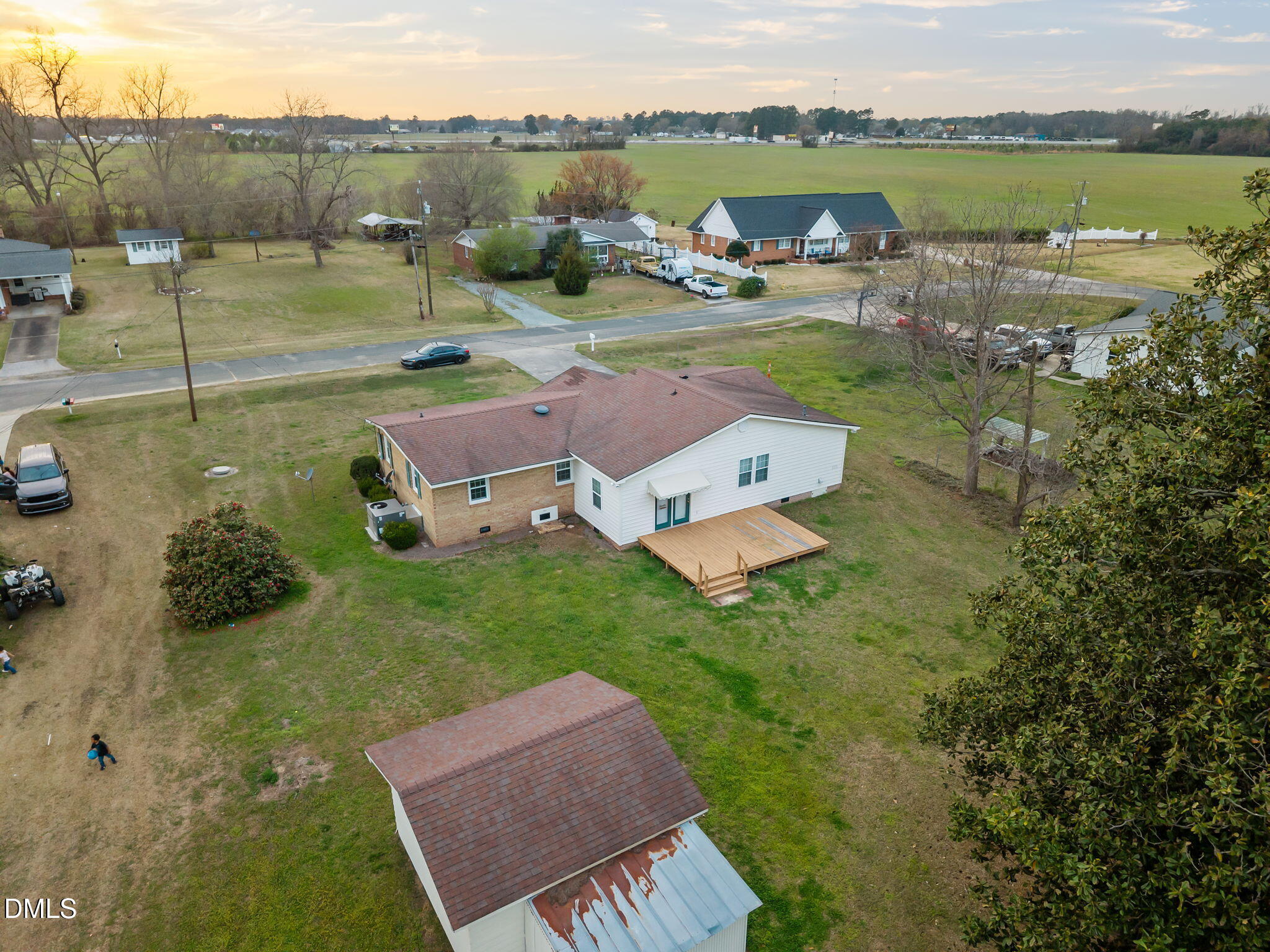 131 Fairview Village Road Dunn, NC 28334 - Photo 41 of 43 an aerial view of a house with garden space and lake view