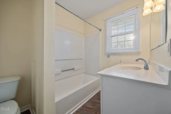 a bathroom with a sink vanity and a mirror