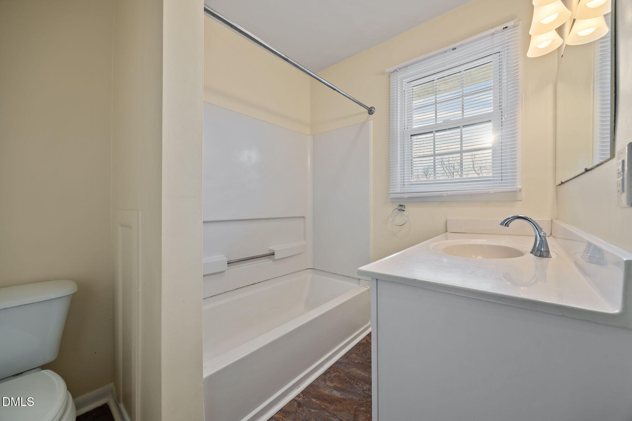 131 Fairview Village Road Dunn, NC 28334 - Photo 8 of 43 a bathroom with a sink toilet vanity and window