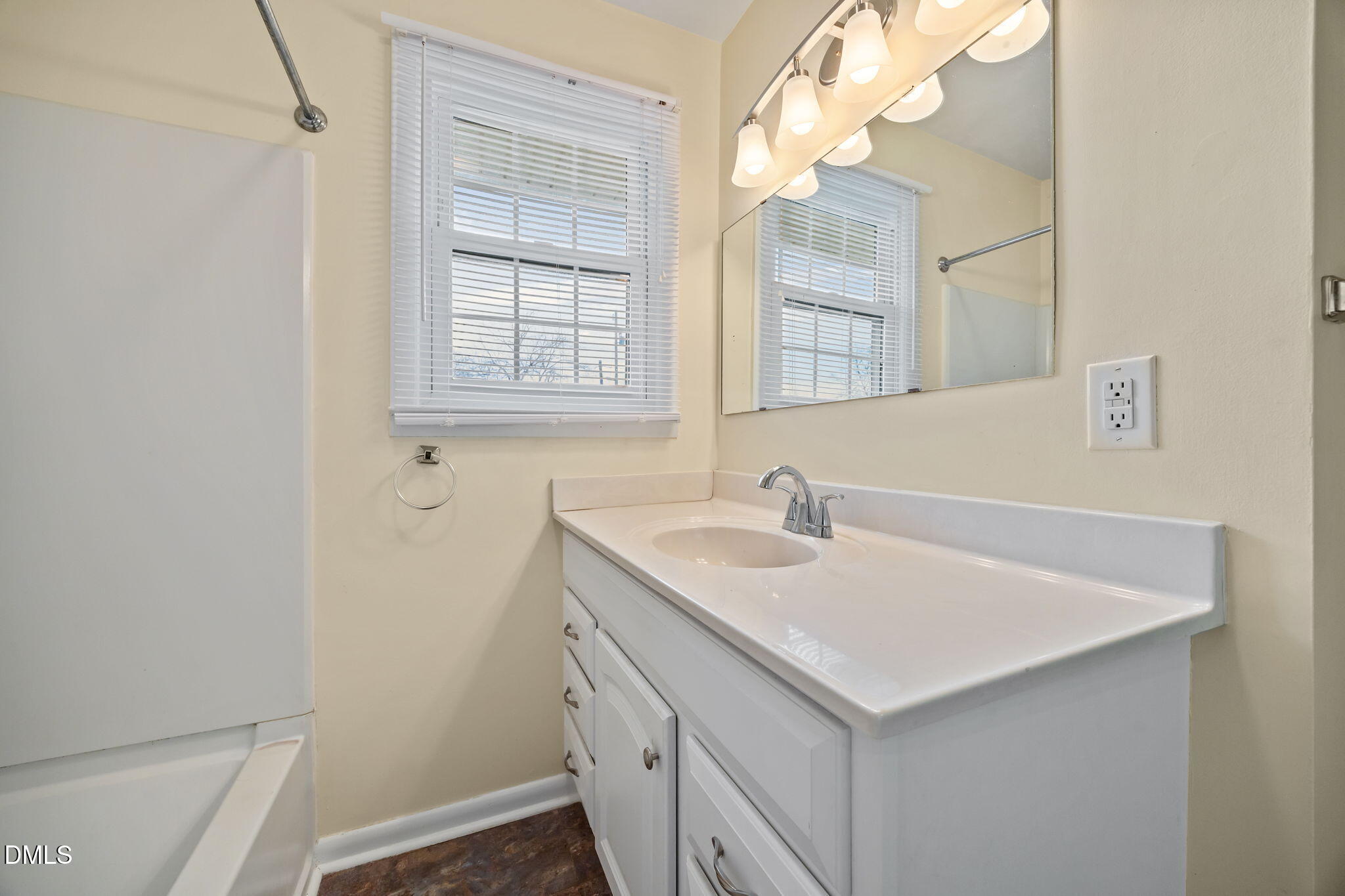 131 Fairview Village Road Dunn, NC 28334 - Photo 9 of 43 a bathroom with a sink vanity and a mirror