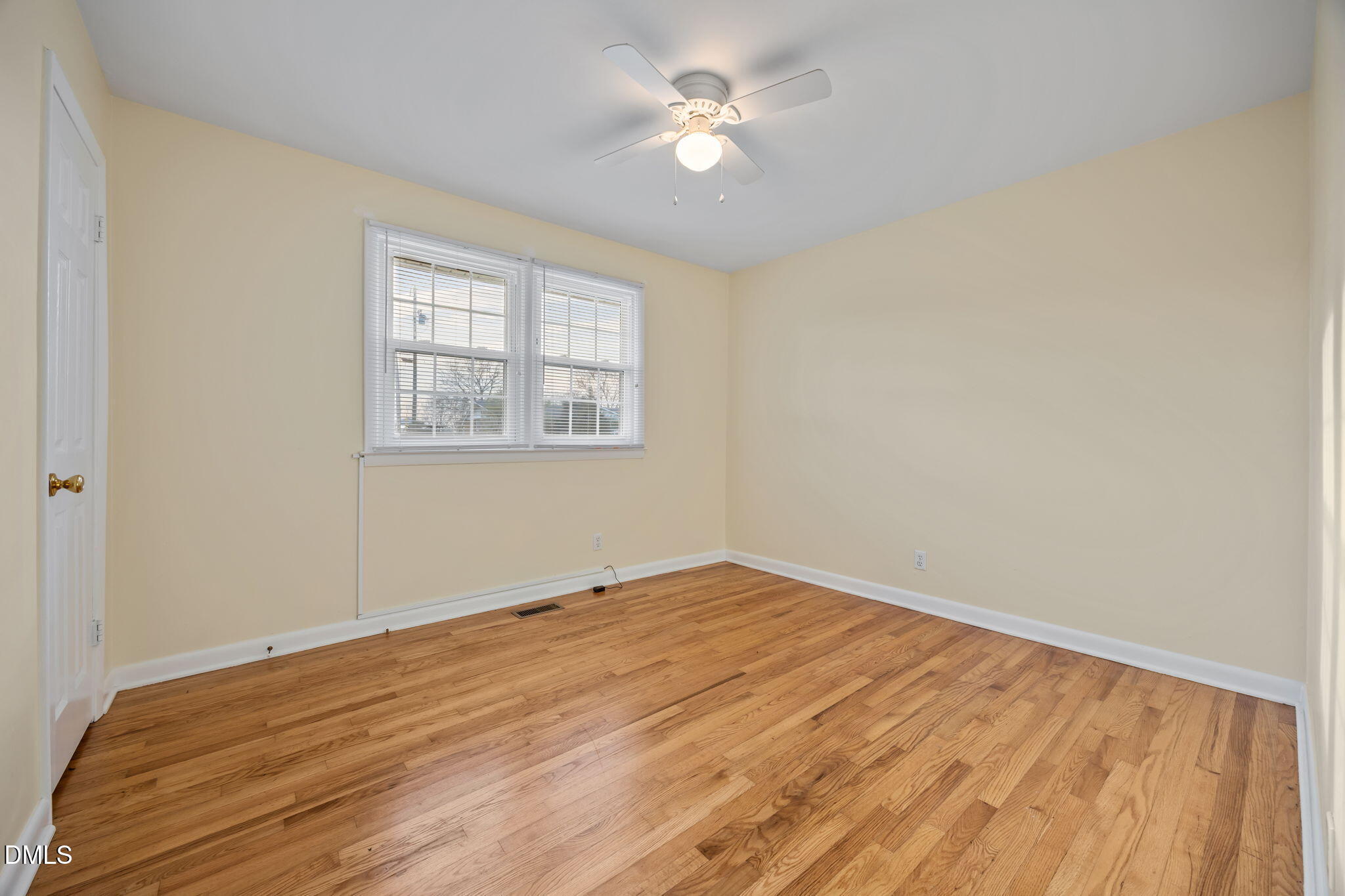 131 Fairview Village Road Dunn, NC 28334 - Photo 10 of 43 a view of empty room with wooden floor and fan