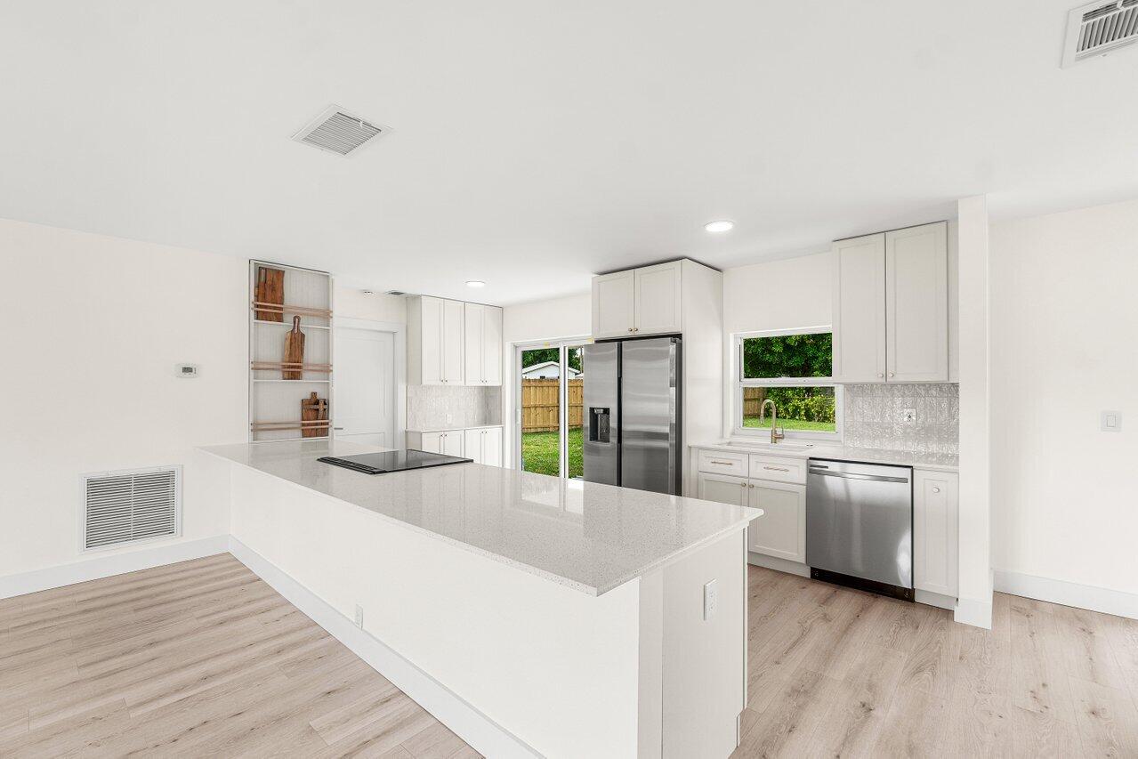 2433 Palm Road West Palm Beach, FL 33406 - Photo 7 of 45 ENTRY LIVING AND KITCHEN