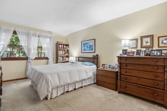 a bed room with a bed and a dresser
