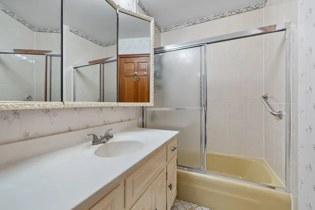 a bathroom with a sink and a mirror