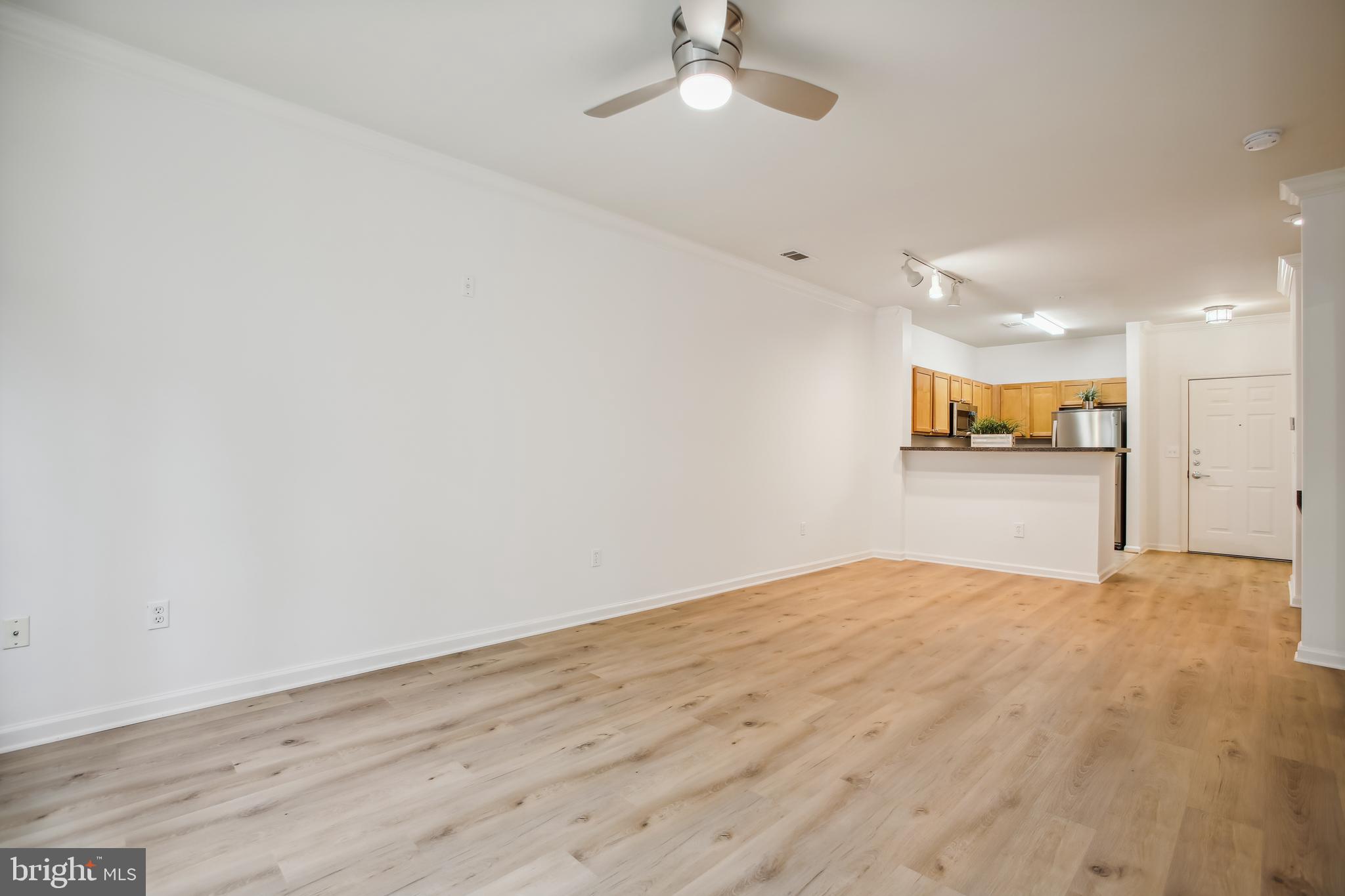 12000 Market Street, Unit 249 Reston, VA 20190 - Photo 35 of 58 Living Room/Dining Area