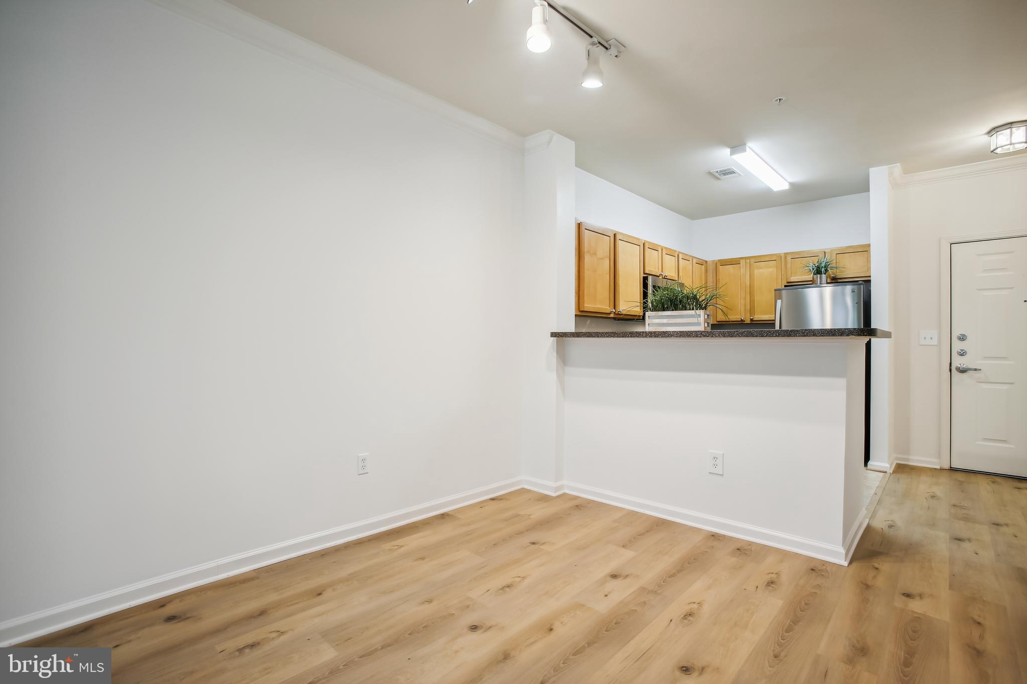 12000 Market Street, Unit 249 Reston, VA 20190 - Photo 36 of 58 Living Room/Dining Area