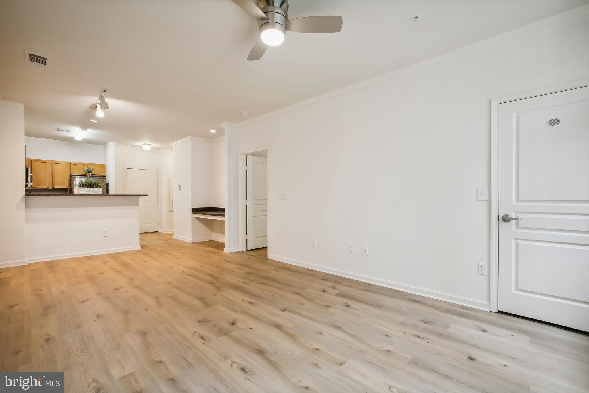 12000 Market Street, Unit 249 Reston, VA 20190 - Photo 37 of 58 Living Room/Dining Area