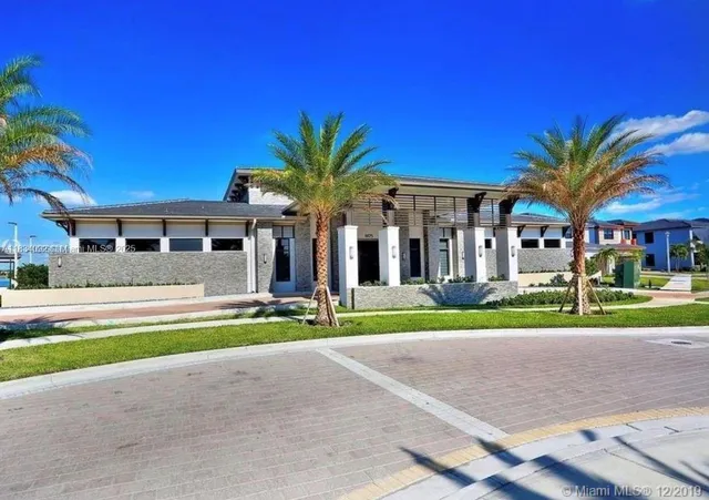 a front view of a house with a yard and porch