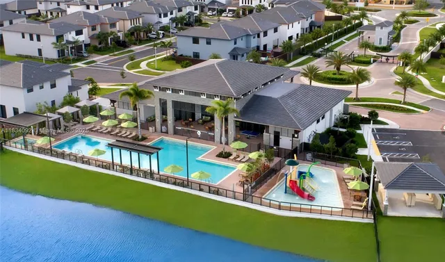 an aerial view of a house with a swimming pool