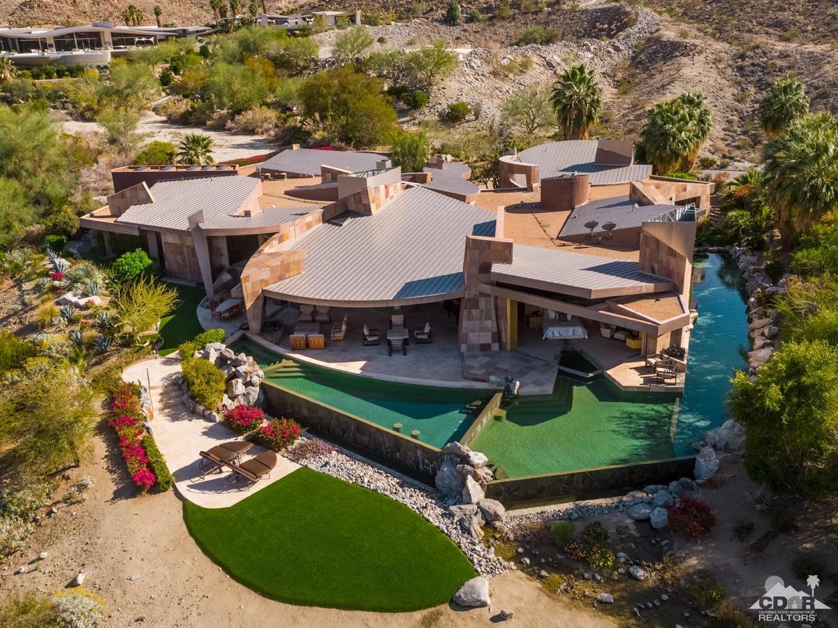632 Pinnacle Crest Palm Desert, CA 92260 - Photo 12 of 52 an aerial view of a house with a garden and lake view