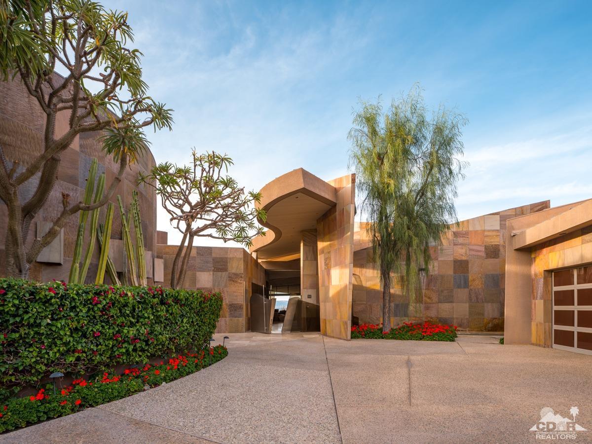 632 Pinnacle Crest Palm Desert, CA 92260 - Photo 15 of 52 a view of a building with a yard and potted plants